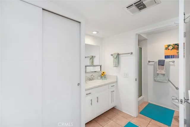 a kitchen with a sink and a refrigerator