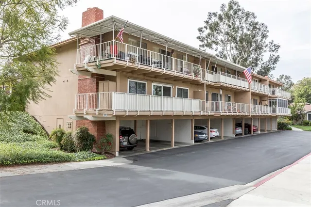 a view of an ocean with a building in the background