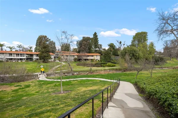 a view of a lake with houses in the back