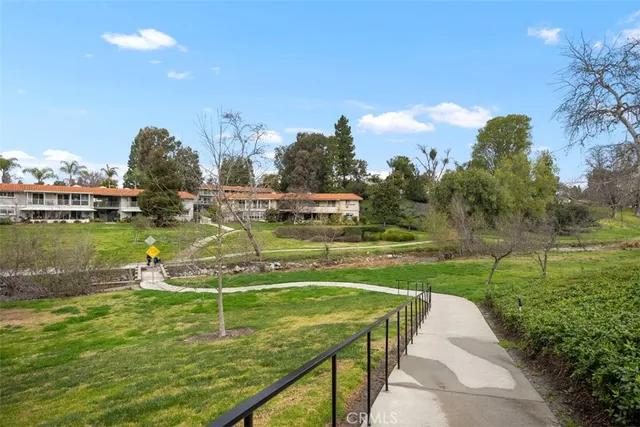 a view of a lake with houses in the back