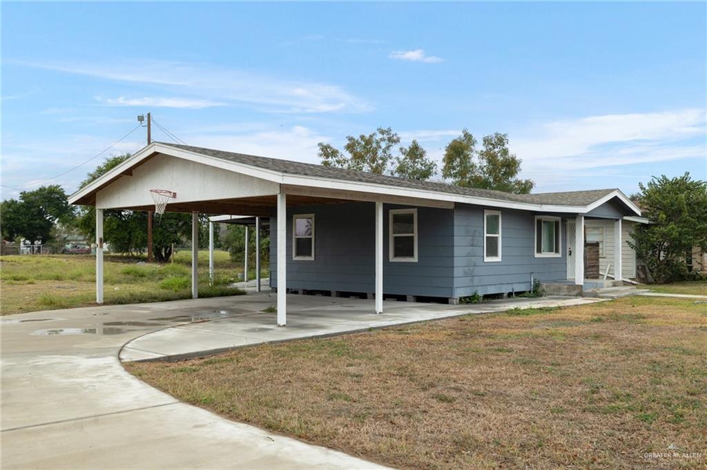 607 Elma Street Weslaco, TX 78596 - Photo 1 of 1 front view of a house with a yard