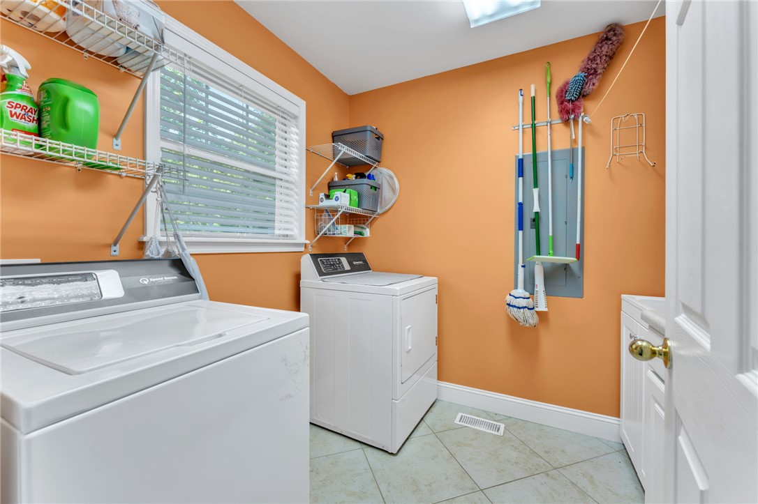 154 Hammond School Road Anderson, SC 29621 - Photo 23 of 33 This functional laundry room features convenient shelving and durable tile flooring for everyday tasks.