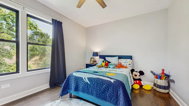 a bed room with a bed and a window