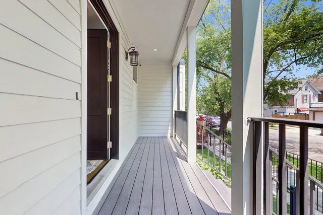a view of a balcony with wooden floor