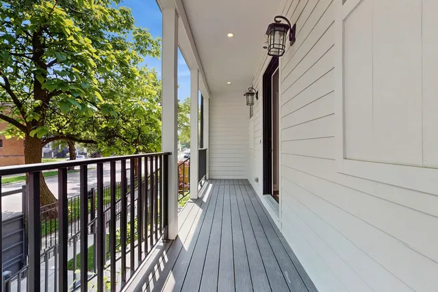 a view of a balcony with wooden floor