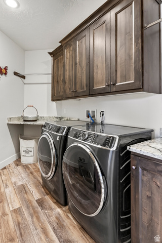 3311 West Allard Summit, UT 84772 - Photo 32 of 97 Laundry area featuring wood-finish flooring and upper wood cabinetry
