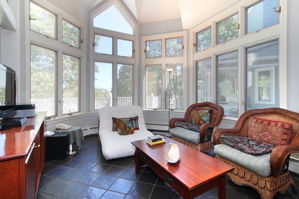 123 Buckminster Road Brookline, MA 02445 - Photo 11 of 28 a living room with furniture and a floor to ceiling window