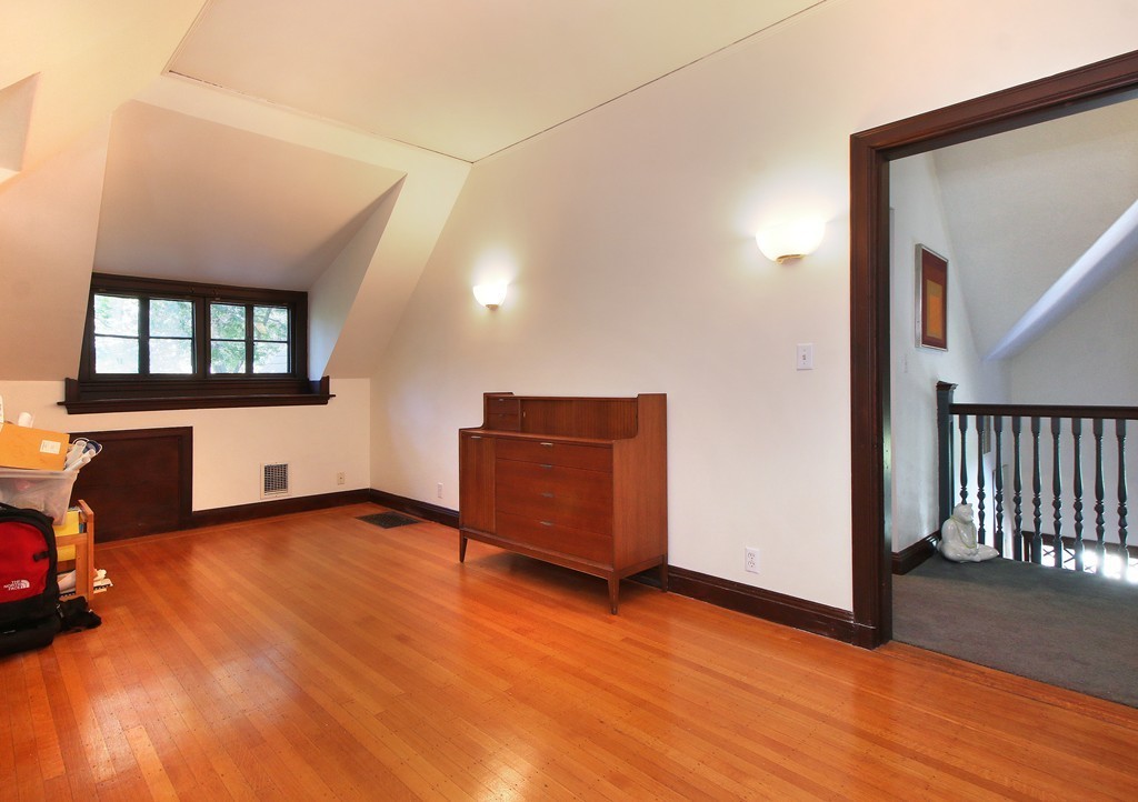 123 Buckminster Road Brookline, MA 02445 - Photo 21 of 28 an empty room with wooden floor and windows