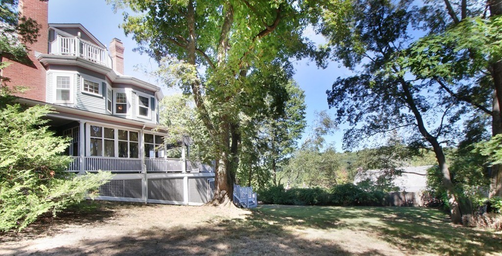 123 Buckminster Road Brookline, MA 02445 - Photo 25 of 28 a front view of a house with a yard and lake view