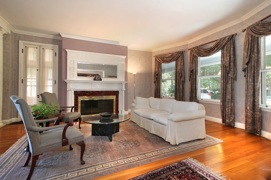 123 Buckminster Road Brookline, MA 02445 - Photo 4 of 28 a living room with furniture large window and a fireplace