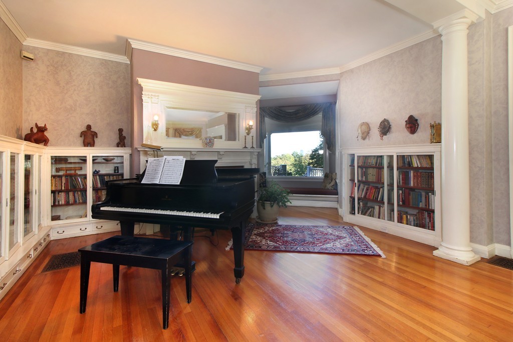 123 Buckminster Road Brookline, MA 02445 - Photo 5 of 28 a living room with furniture a rug and a floor to ceiling window