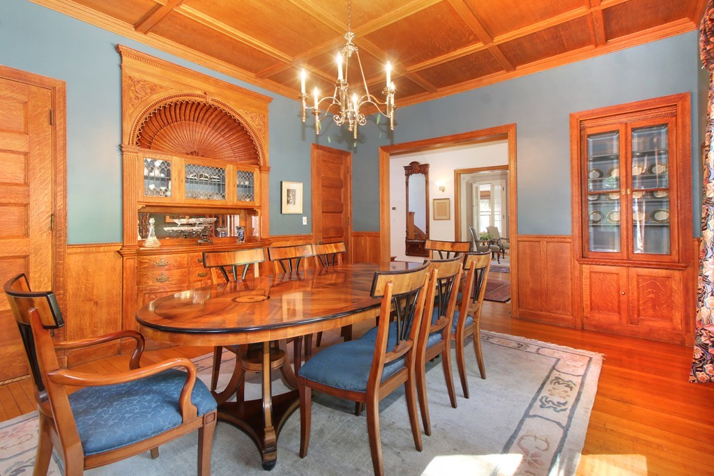 123 Buckminster Road Brookline, MA 02445 - Photo 7 of 28 a dining room with furniture a chandelier and wooden floor