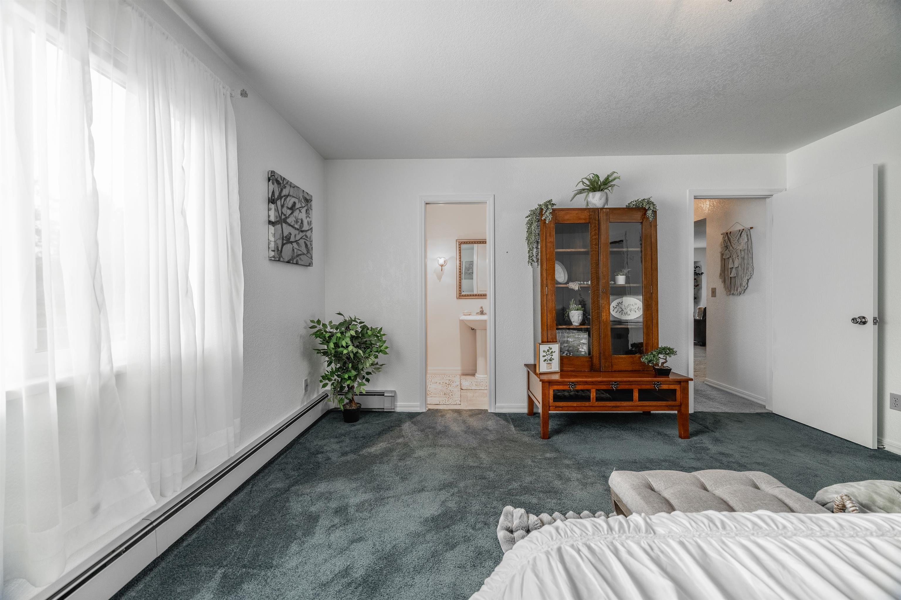 2135 Winston Way, Unit B Montrose, CO 81401 - Photo 18 of 25 a living room with furniture and large windows