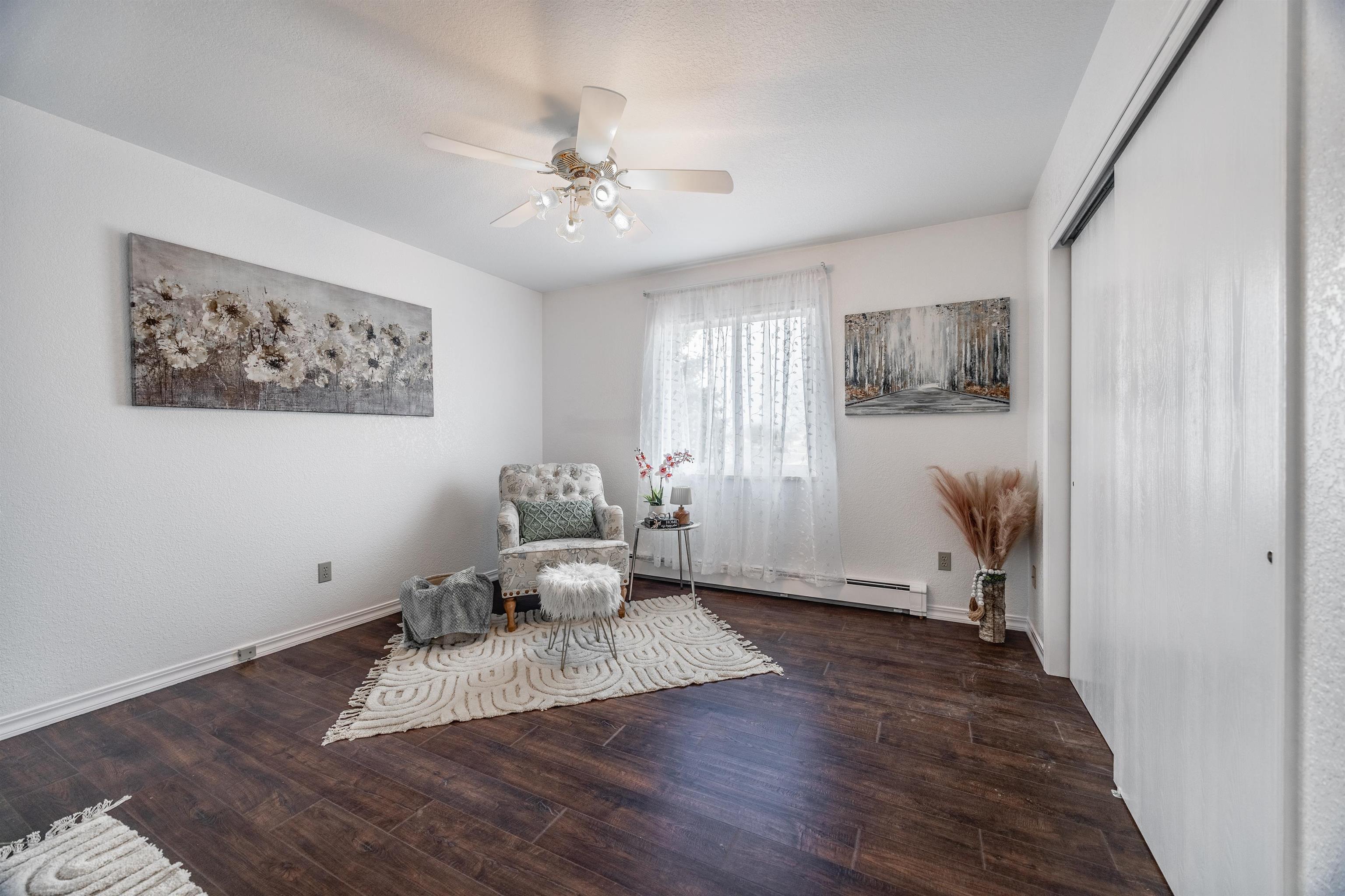 2135 Winston Way, Unit B Montrose, CO 81401 - Photo 21 of 25 a living room with furniture and a chandelier