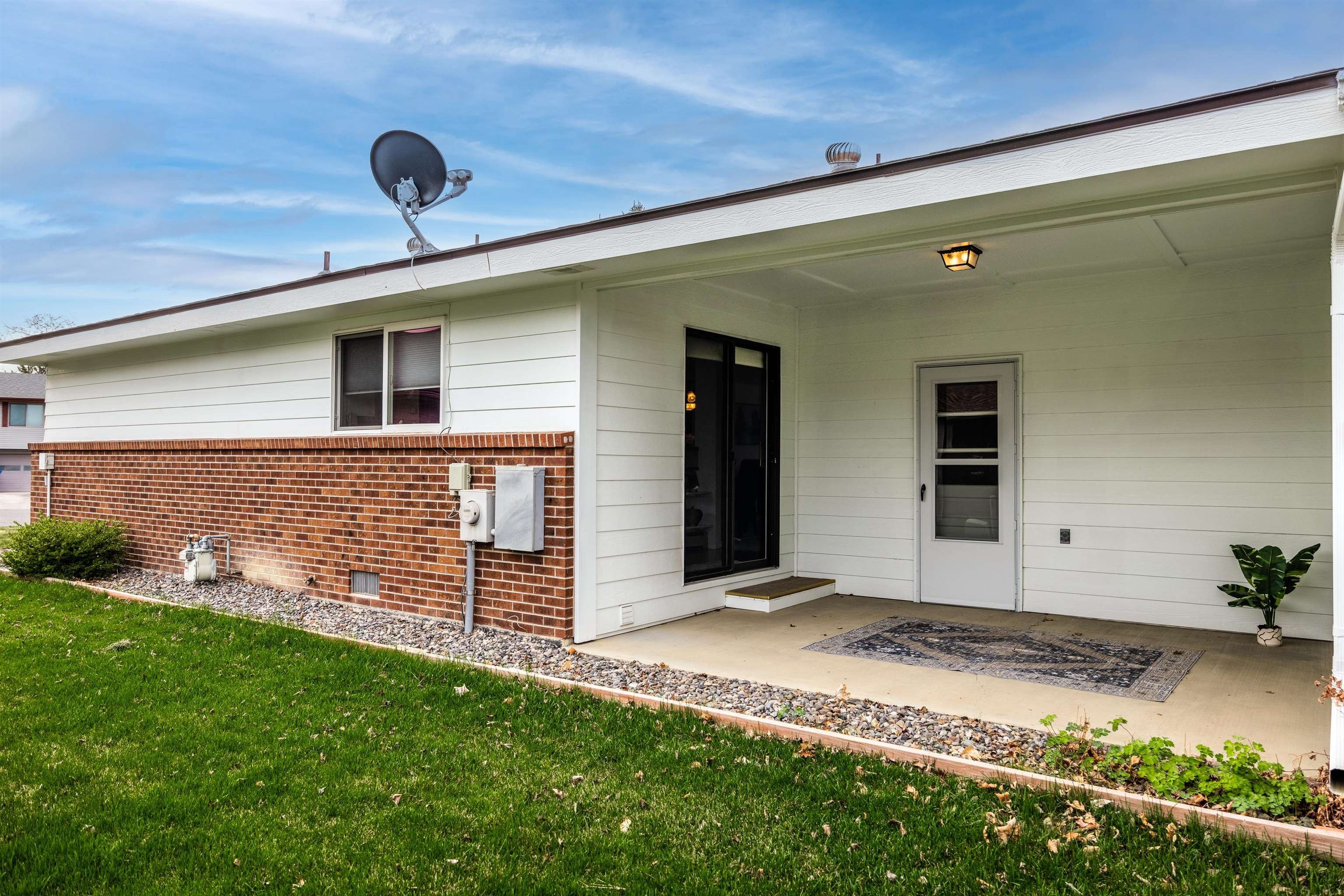 2135 Winston Way, Unit B Montrose, CO 81401 - Photo 3 of 25 a front view of a house with garden