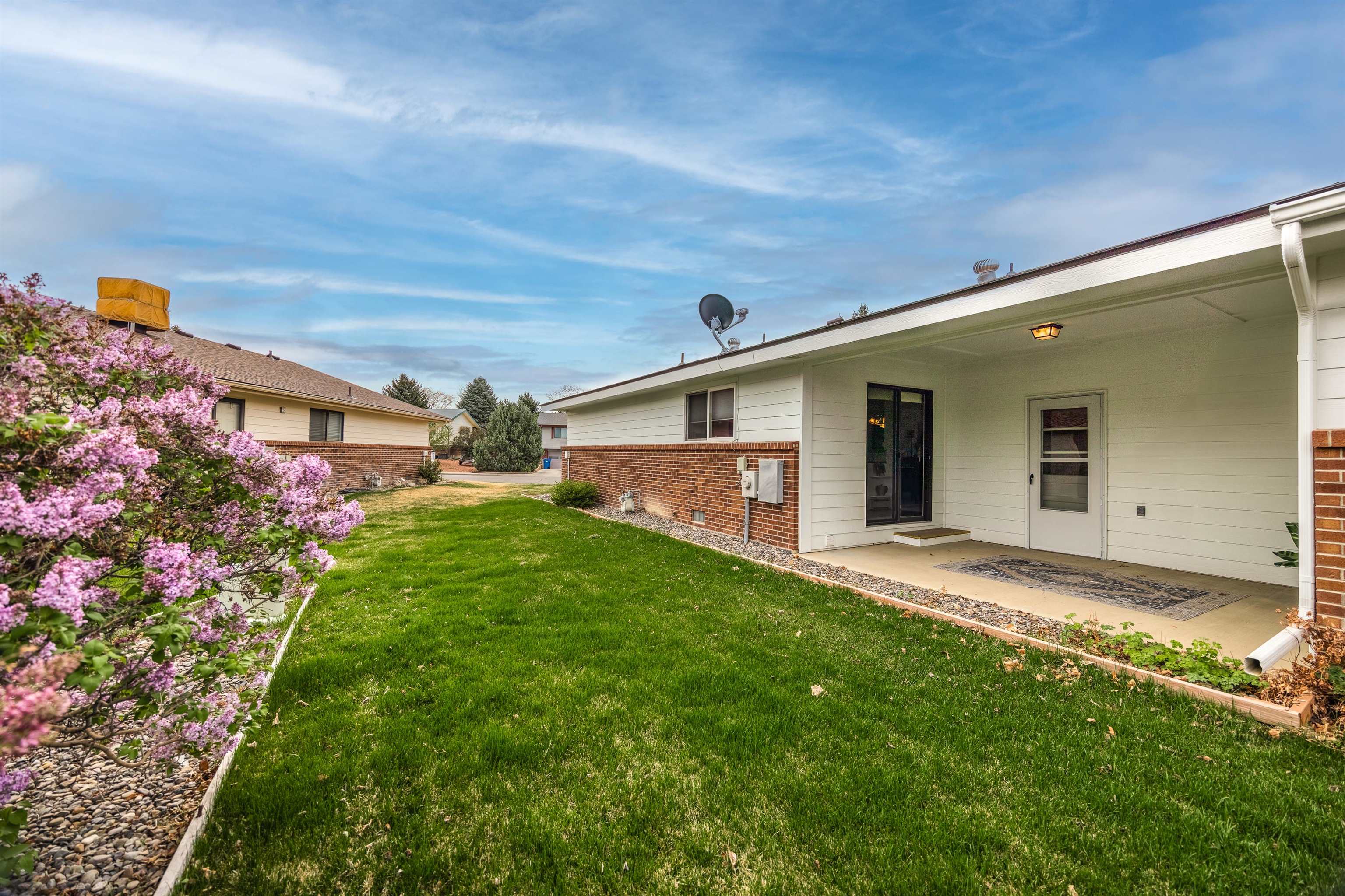 2135 Winston Way, Unit B Montrose, CO 81401 - Photo 4 of 25 a view of a backyard of the house