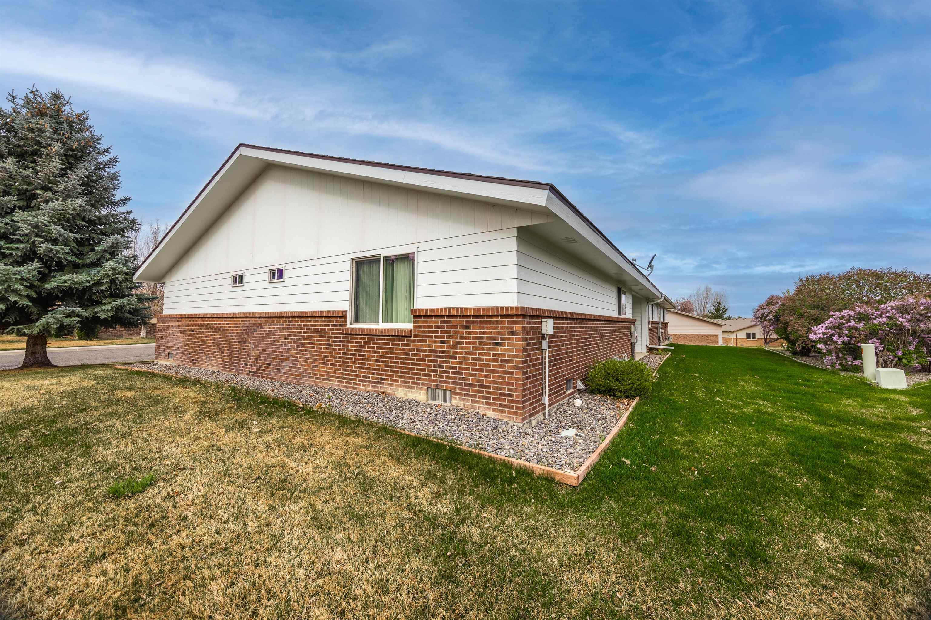2135 Winston Way, Unit B Montrose, CO 81401 - Photo 5 of 25 a view of a house with a yard and fence