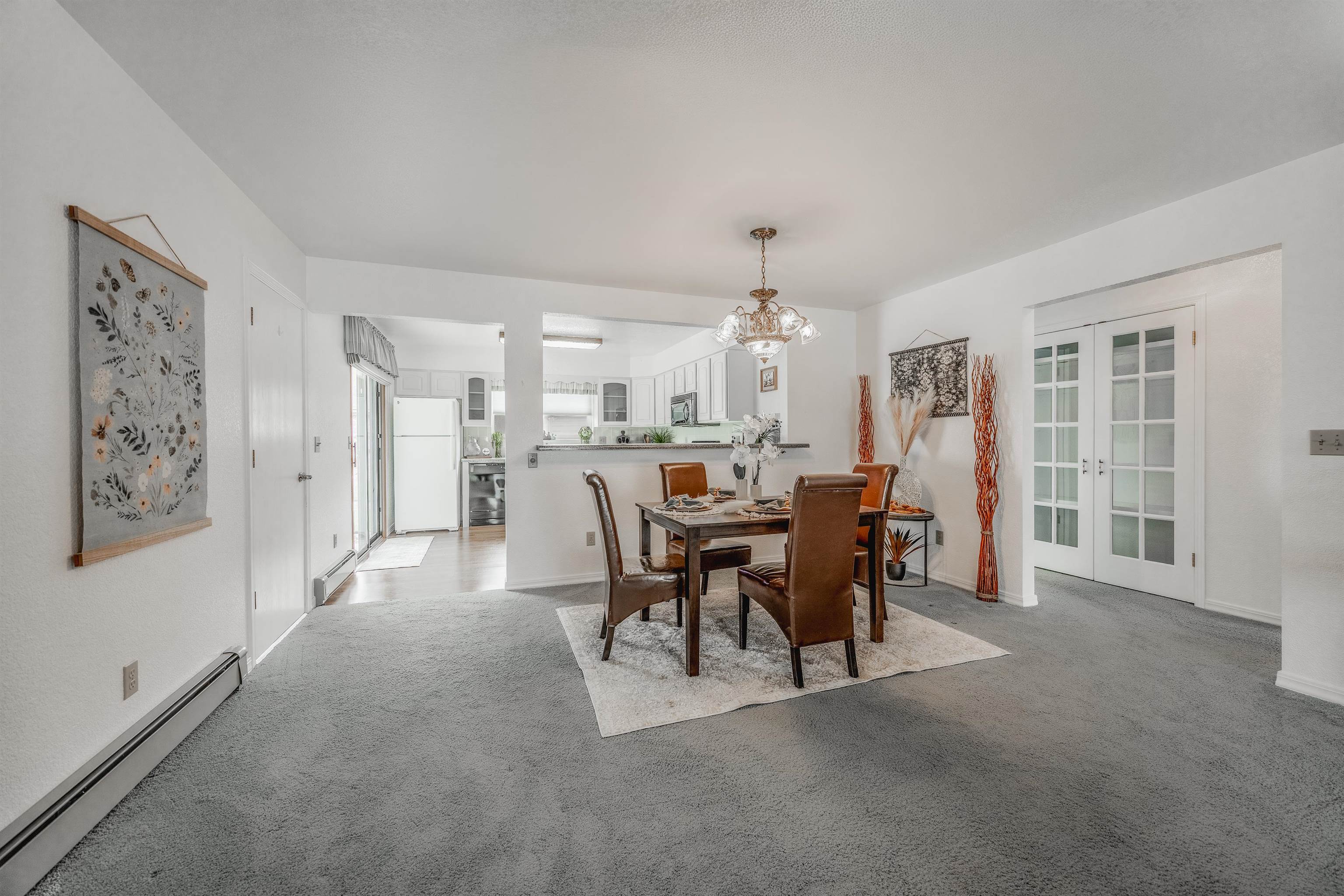 2135 Winston Way, Unit B Montrose, CO 81401 - Photo 8 of 25 a view of a dining room with furniture and chandelier