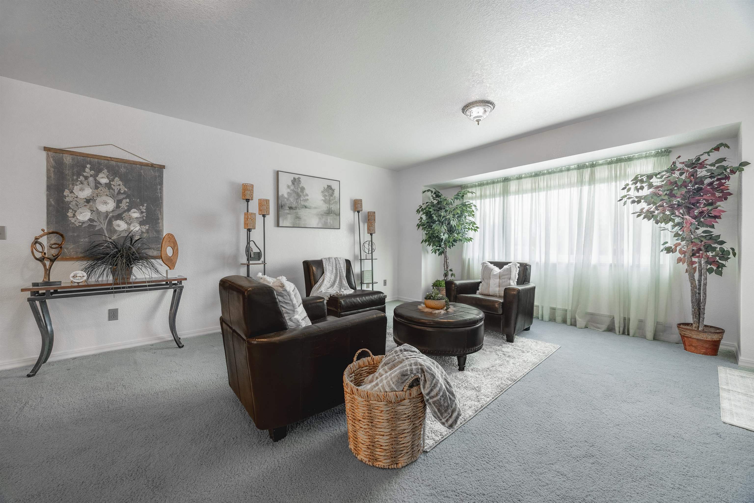 2135 Winston Way, Unit B Montrose, CO 81401 - Photo 9 of 25 a living room with furniture and a large window
