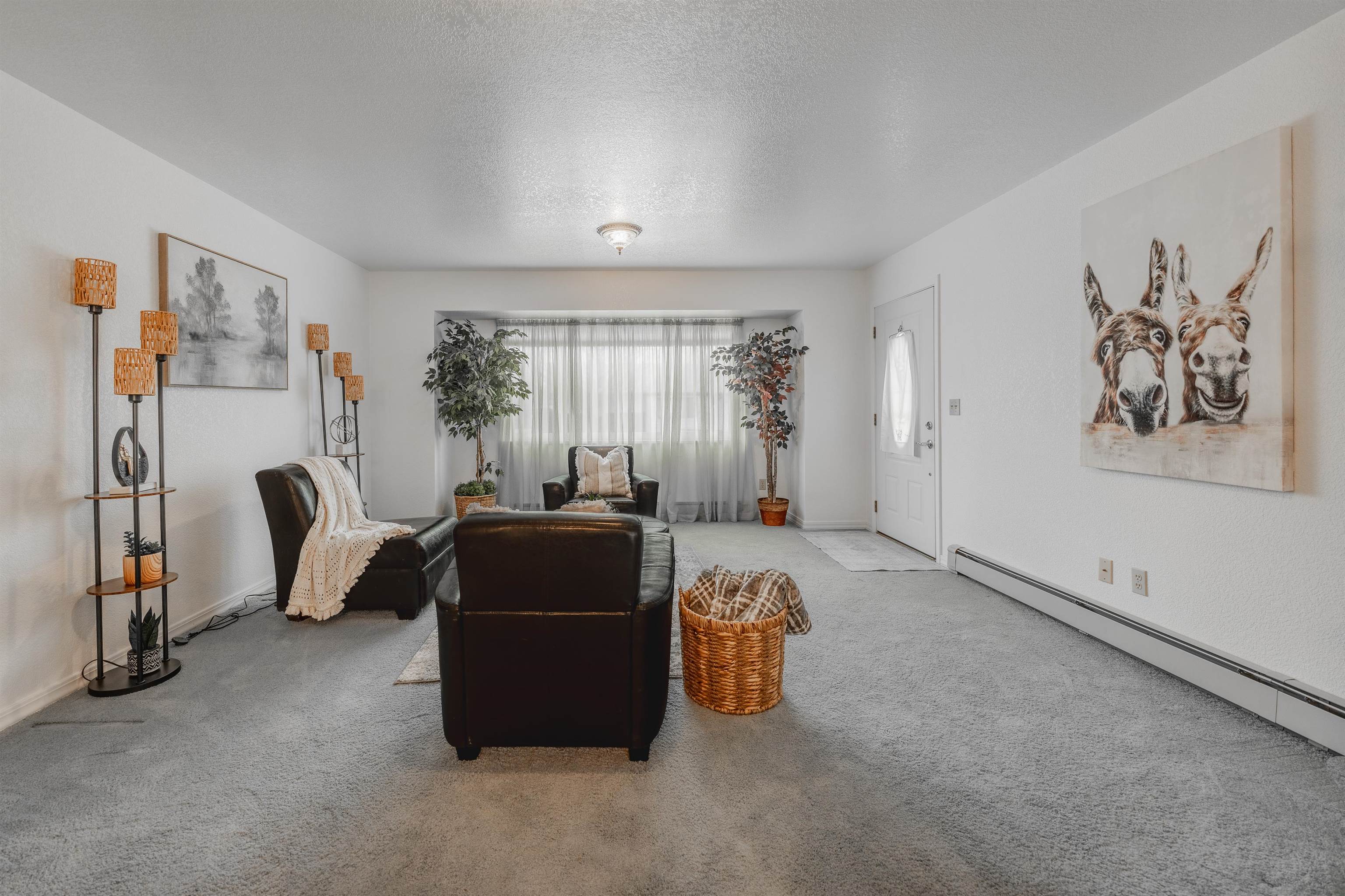 2135 Winston Way, Unit B Montrose, CO 81401 - Photo 10 of 25 a living room with furniture a window and gym equipment