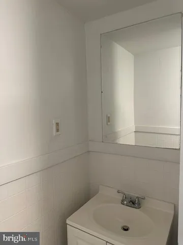 a bathroom with a sink and vanity