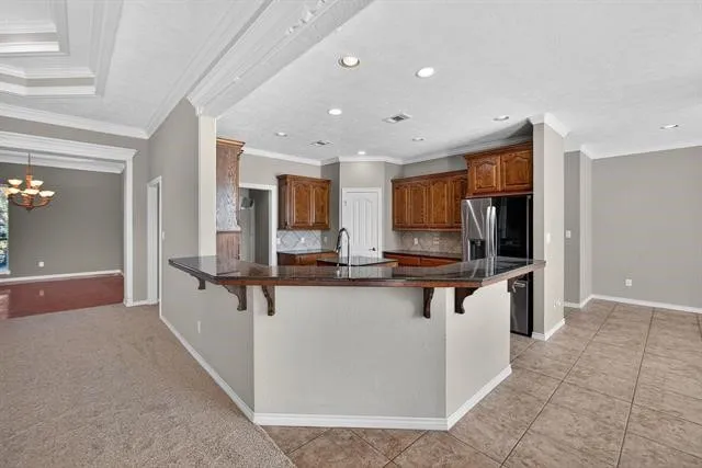 a kitchen with counter top space and stainless steel appliances
