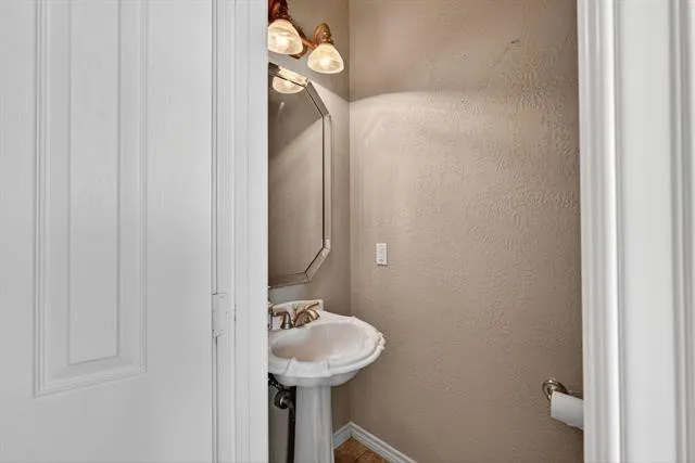 a bathroom with a sink and toilet