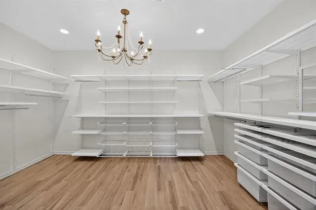 a view of room with wooden floor and staircase