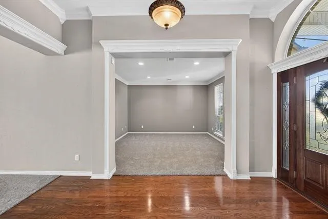 a view of room with wooden floor and window
