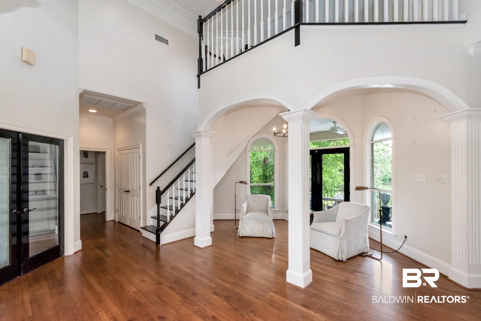 2640 Meadowlake Road Semmes, AL 36575 - Photo 13 of 55 Entryway featuring decorative columns, arched walkways, ornamental molding, dark wood-type flooring, and french doors
