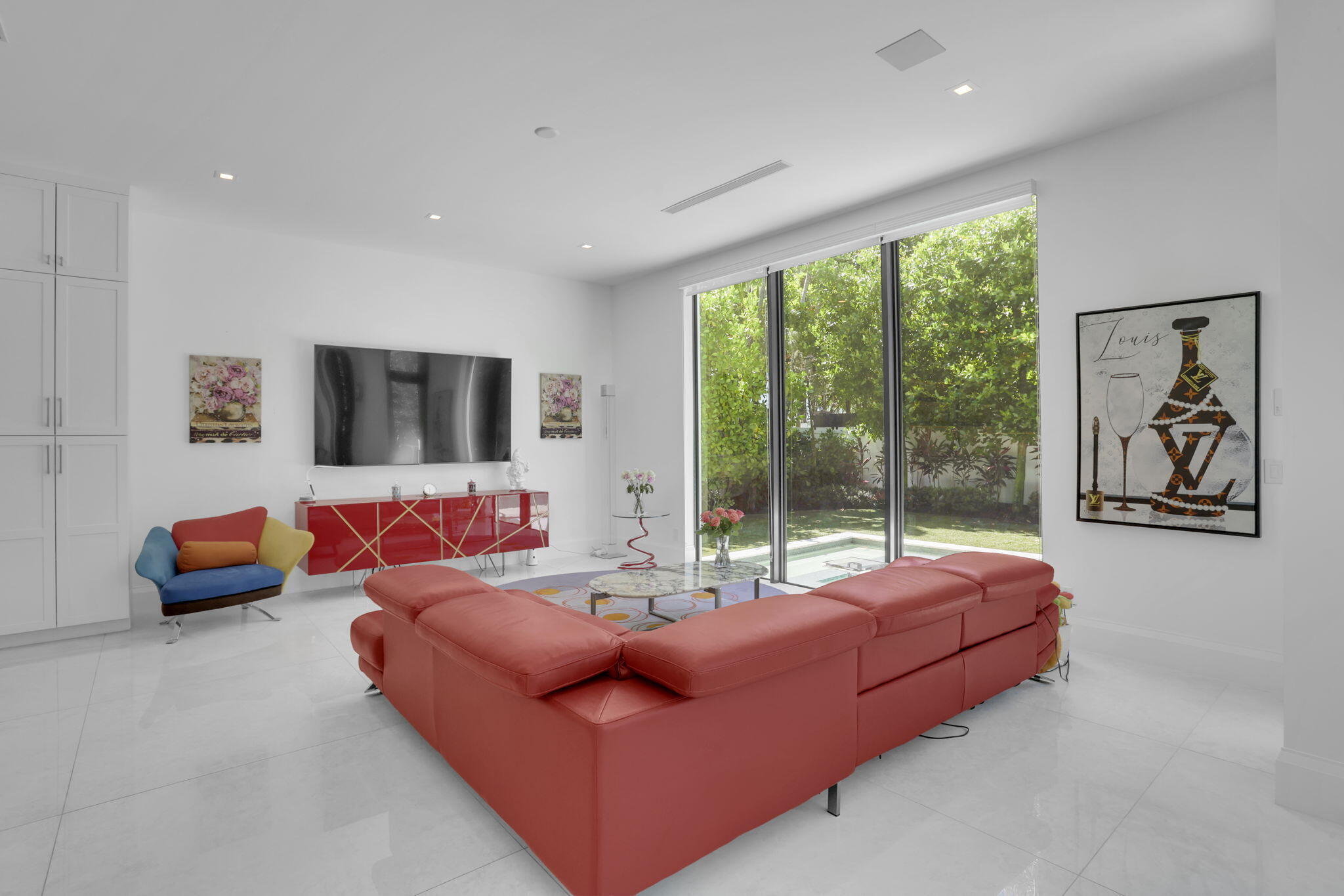 234 Northeast 4th Street Boca Raton, FL 33432 - Photo 15 of 72 a living room with furniture and a flat screen tv