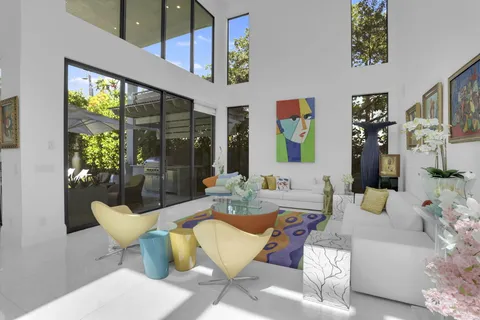 a view of a backyard with swimming pool