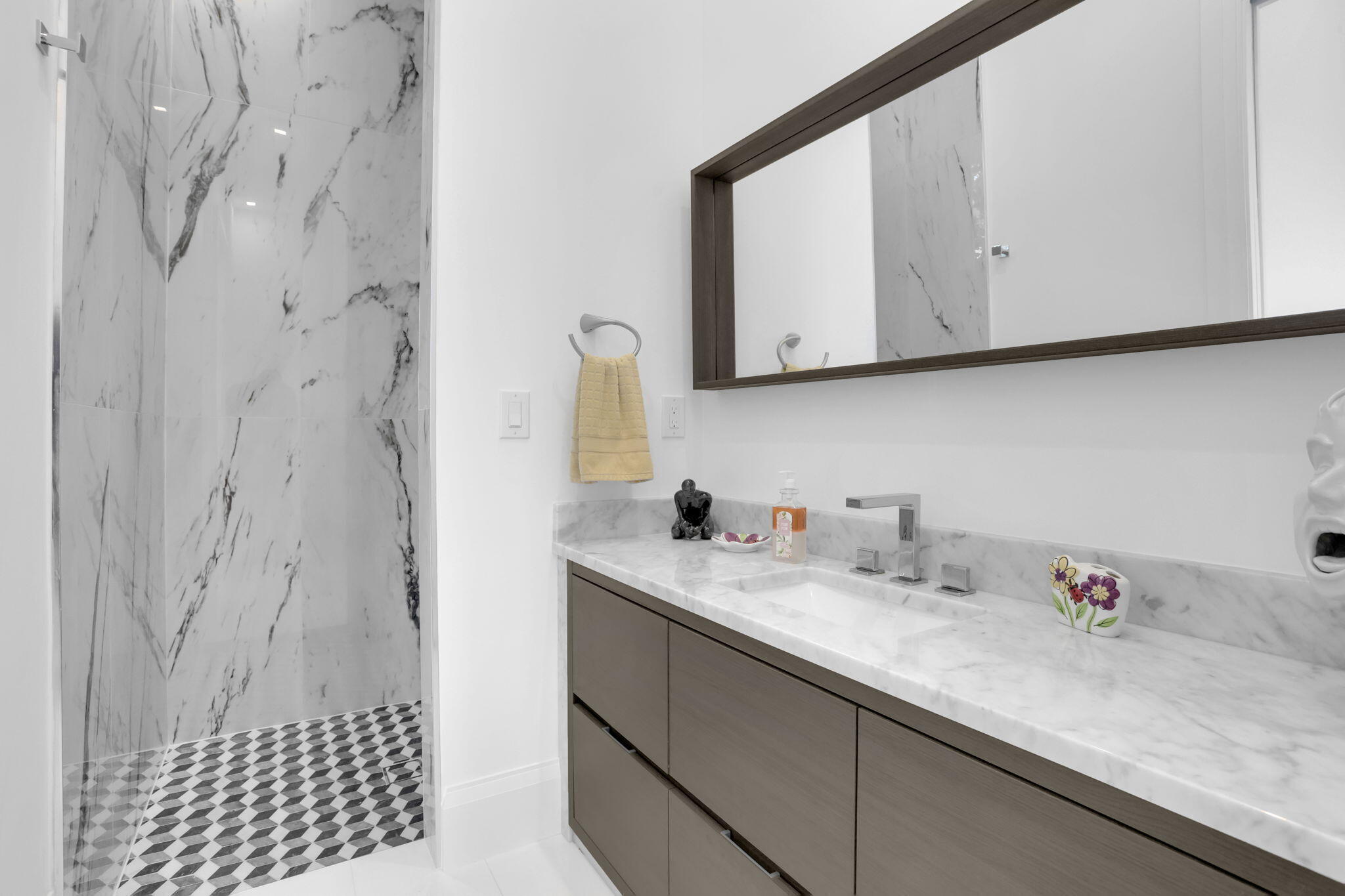 234 Northeast 4th Street Boca Raton, FL 33432 - Photo 27 of 72 a bathroom with a sink and a mirror