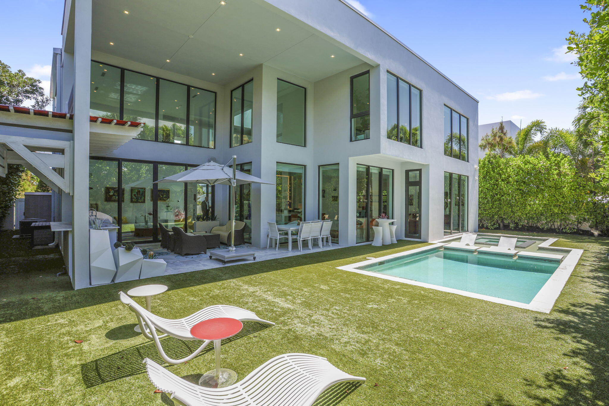 234 Northeast 4th Street Boca Raton, FL 33432 - Photo 29 of 72 a view of a patio with swimming pool table and chairs