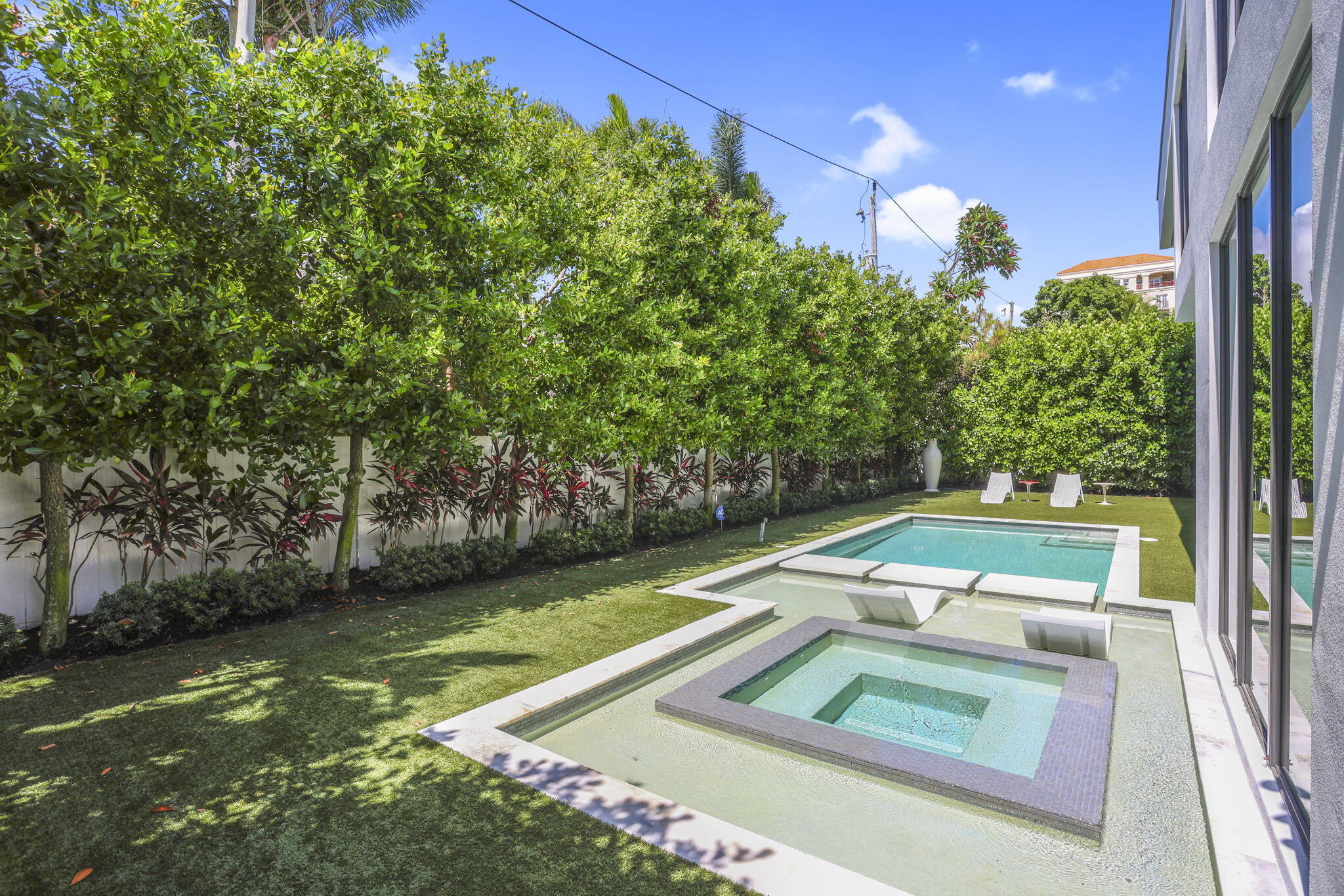 234 Northeast 4th Street Boca Raton, FL 33432 - Photo 35 of 72 a view of a swimming pool with a yard