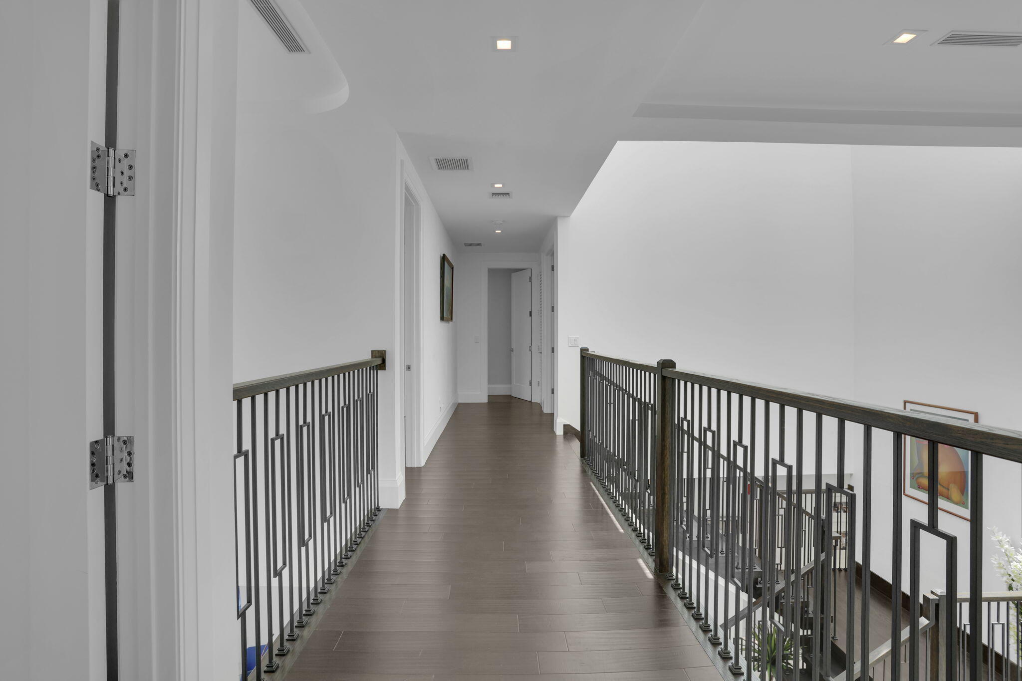 234 Northeast 4th Street Boca Raton, FL 33432 - Photo 38 of 72 a view of a hallway with wooden floor and a bathroom