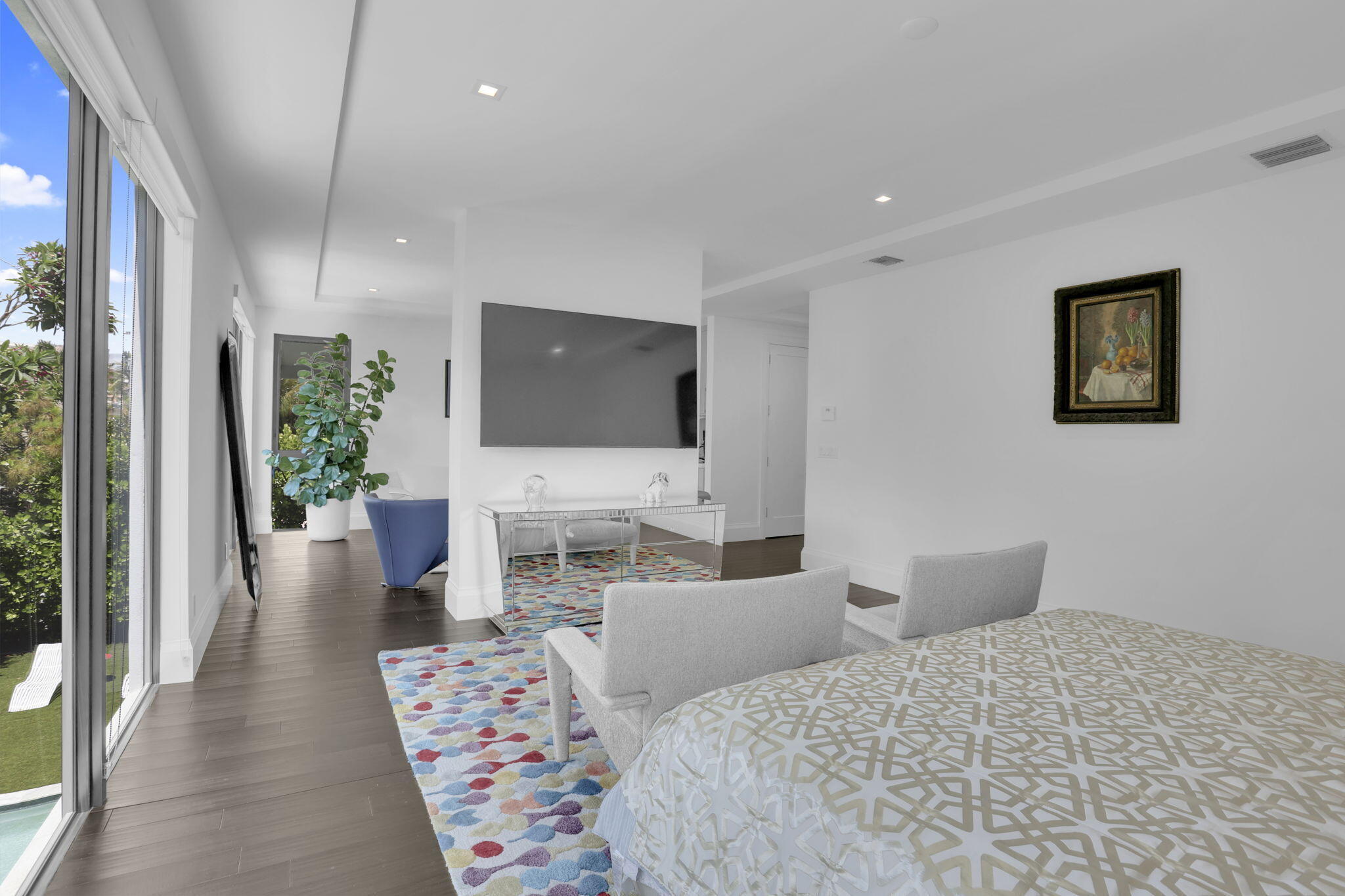 234 Northeast 4th Street Boca Raton, FL 33432 - Photo 43 of 72 a bedroom with a bed and a flat screen tv