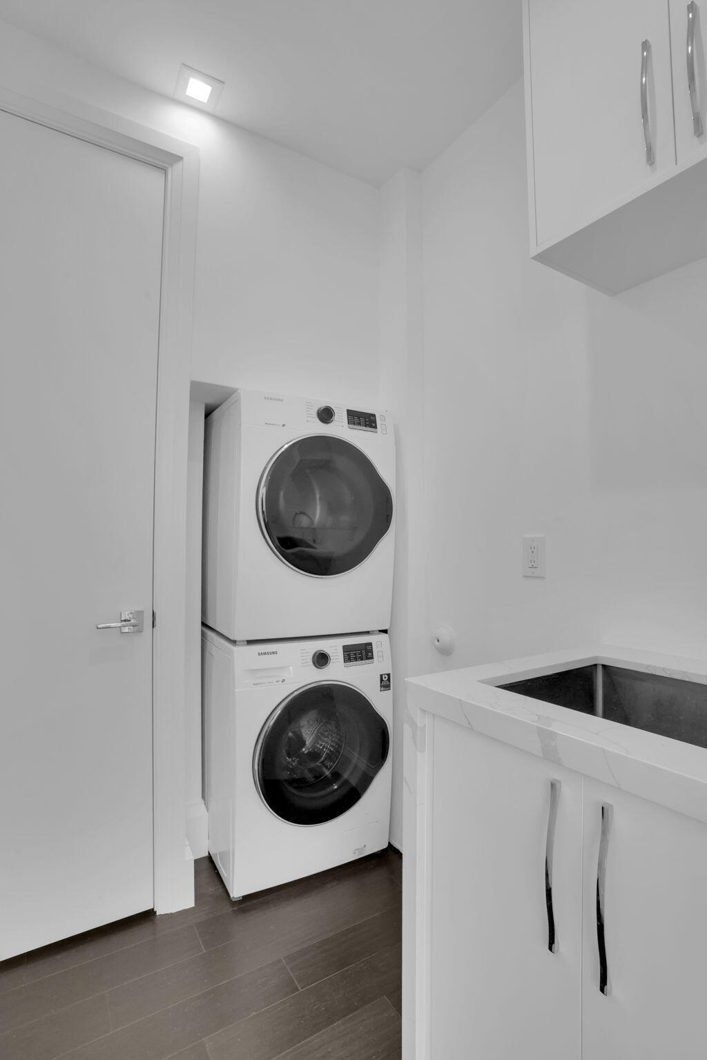234 Northeast 4th Street Boca Raton, FL 33432 - Photo 62 of 72 a view of a storage & utility room with a washer dryer