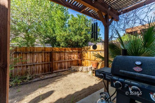 420 Montefino Drive Ridgecrest, CA 93555 - Photo 32 of 38 a backyard of a house with barbeque oven