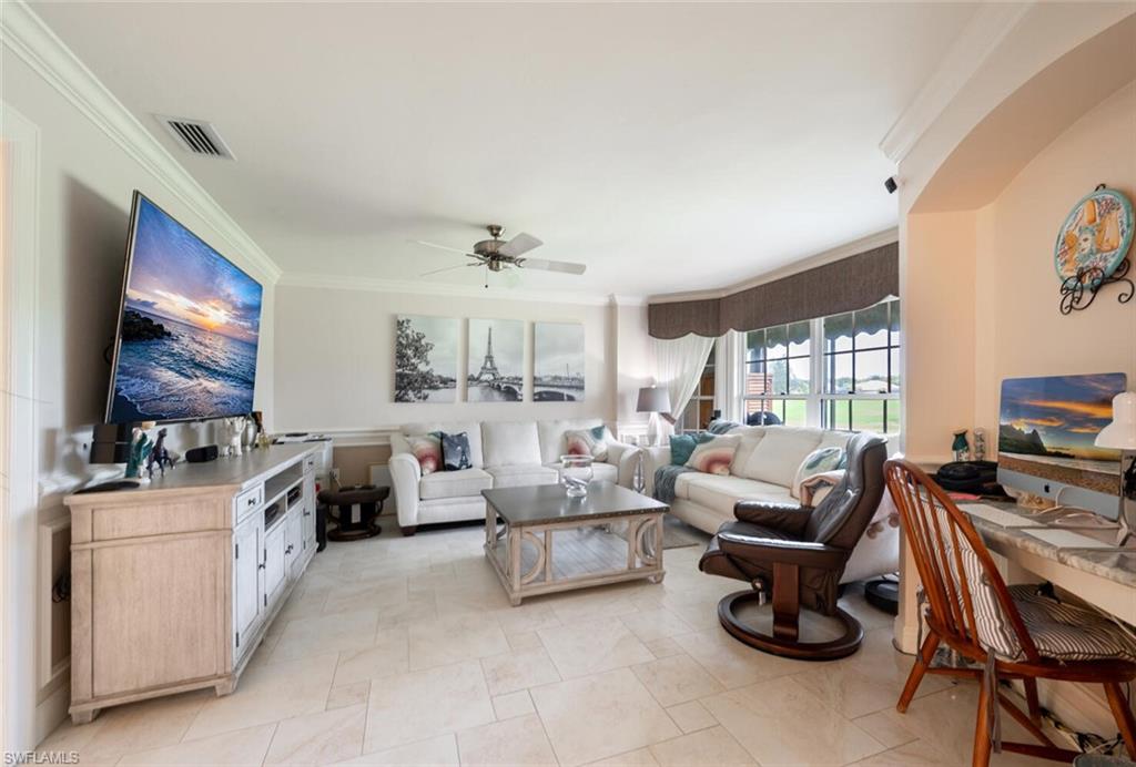 644 Augusta Boulevard Naples, FL 34113 - Photo 12 of 40 a living room with furniture and a flat screen tv