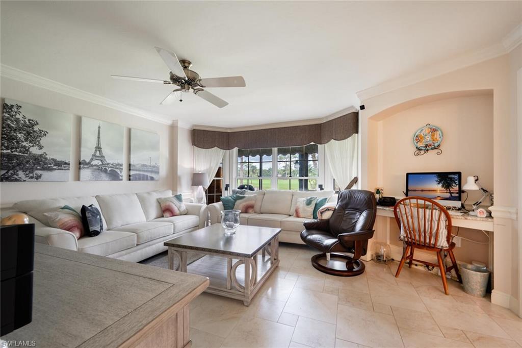 644 Augusta Boulevard Naples, FL 34113 - Photo 13 of 40 a living room with furniture and a large window