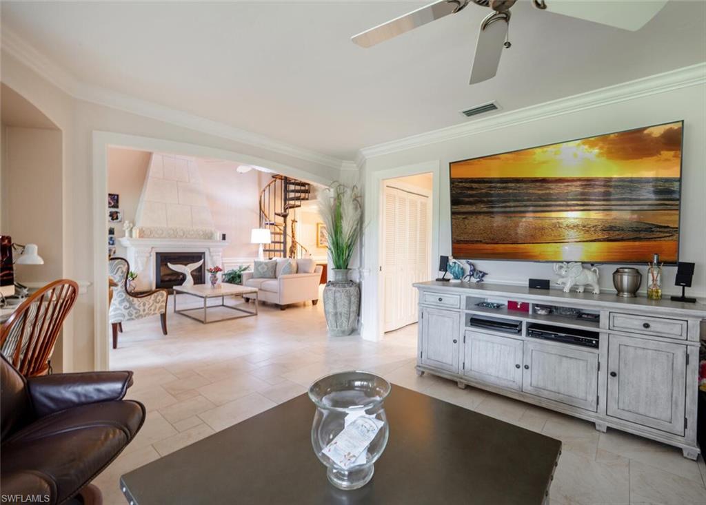 644 Augusta Boulevard Naples, FL 34113 - Photo 15 of 40 a living room with furniture and a flat screen tv