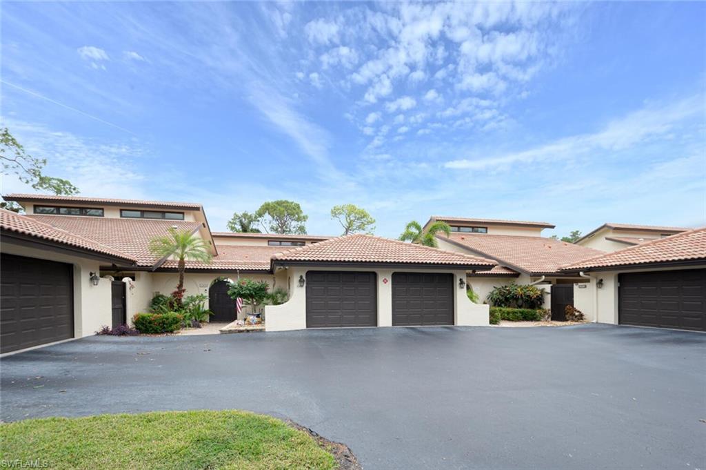 644 Augusta Boulevard Naples, FL 34113 - Photo 30 of 40 front view of a house with a street