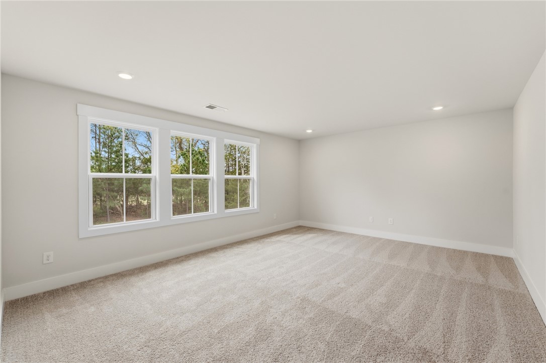 319 Summerall Drive Anderson, SC 29621 - Photo 23 of 37 This spacious room features ample natural light and a serene view of the surrounding trees.
