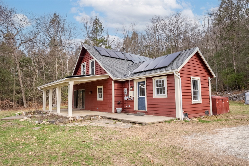 147 Worthington Road Huntington, MA 01050 - Photo 1 of 39 a front view of a house with a yard