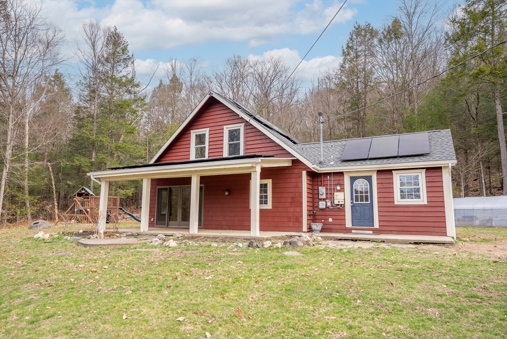 147 Worthington Road Huntington, MA 01050 - Photo 23 of 39 a front view of a house with garden