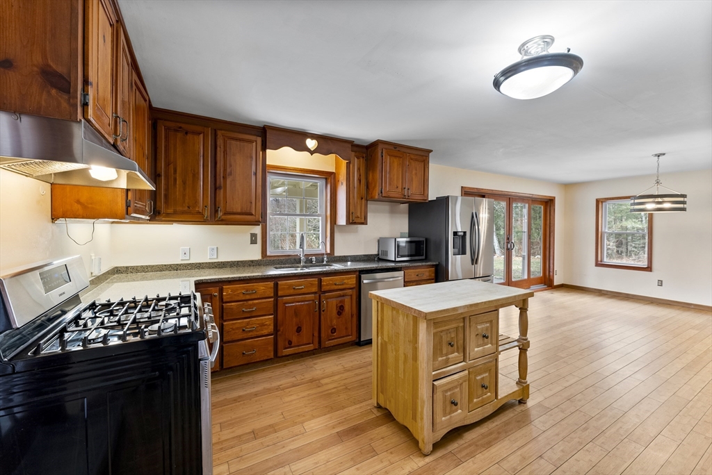147 Worthington Road Huntington, MA 01050 - Photo 3 of 39 a kitchen with a stove a sink and a refrigerator