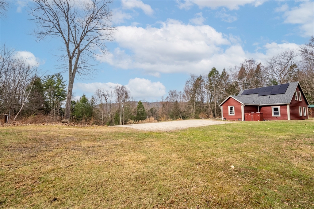 147 Worthington Road Huntington, MA 01050 - Photo 31 of 39 a view of a house with a yard