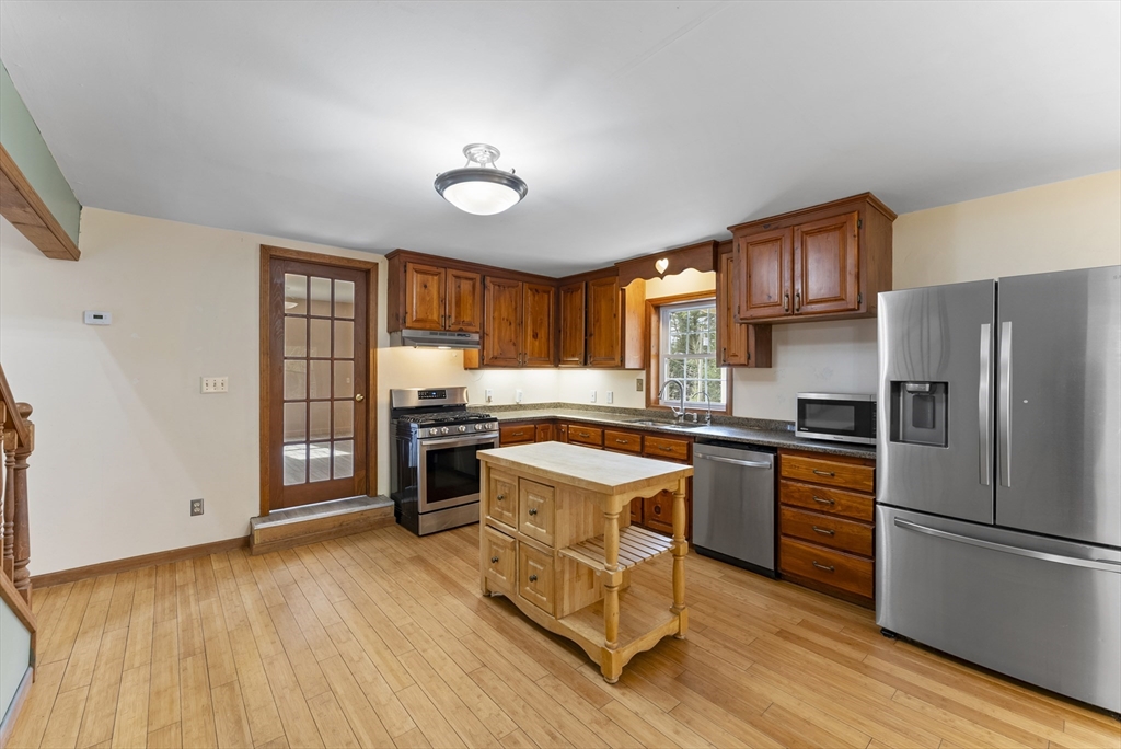 147 Worthington Road Huntington, MA 01050 - Photo 4 of 39 a kitchen with granite countertop a refrigerator stove top oven and sink