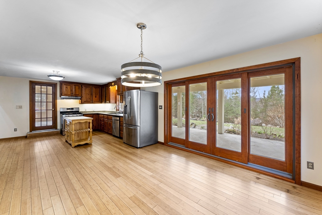 147 Worthington Road Huntington, MA 01050 - Photo 8 of 39 a kitchen with stainless steel appliances granite countertop a stove and a wooden floors